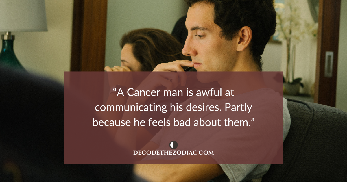 Couple sitting on a couch ignoring each other with a quote that says a Cancer man is bad at communicating his feelings
